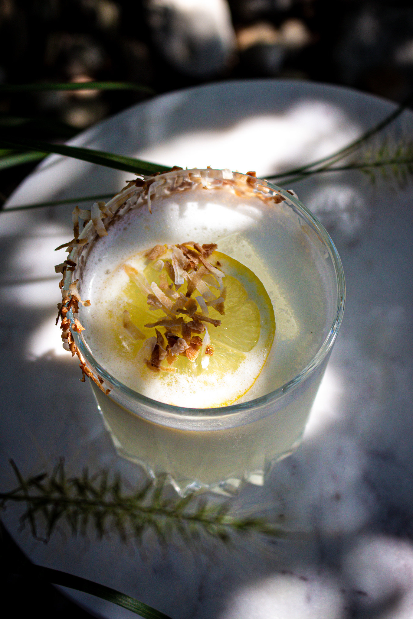 Close view of a garnished House Pour cocktail