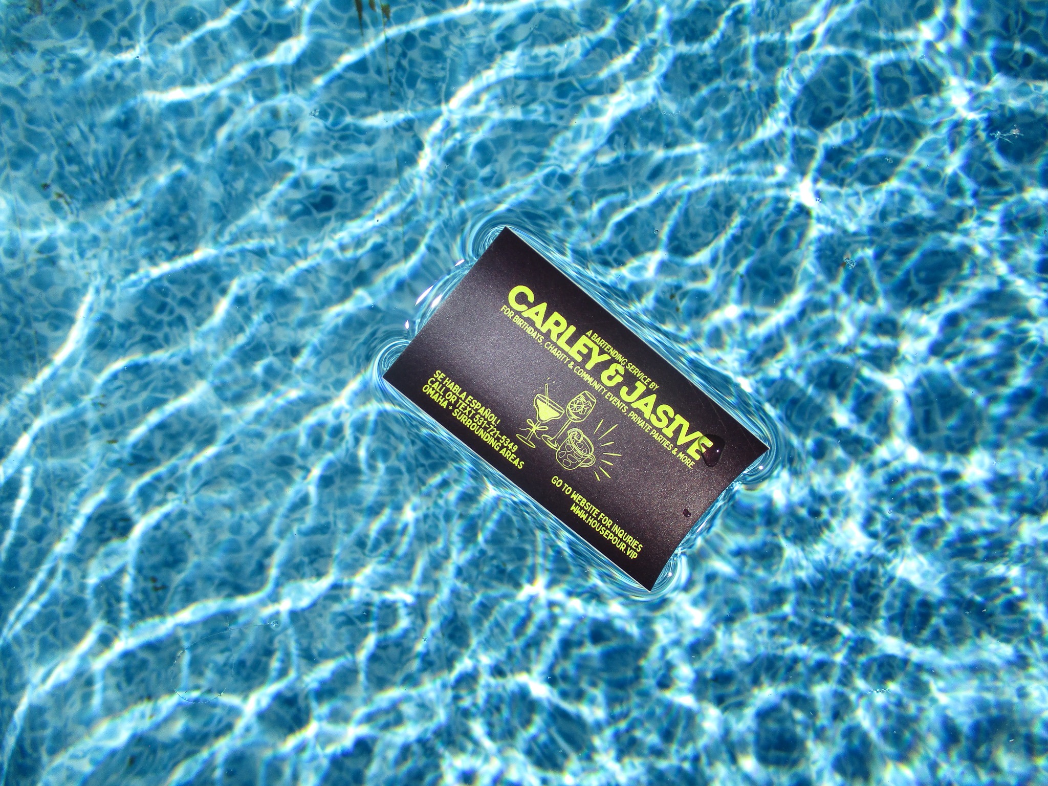 Carley and Jasive’s House Pour card over blue pool water